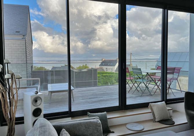 view of terrace and sea from living room