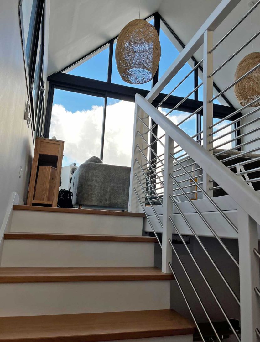 view from staircase to upper floor and sky